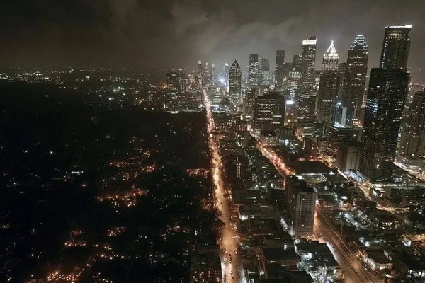 A dark residential street on the fifth day of a prolonged power outage
