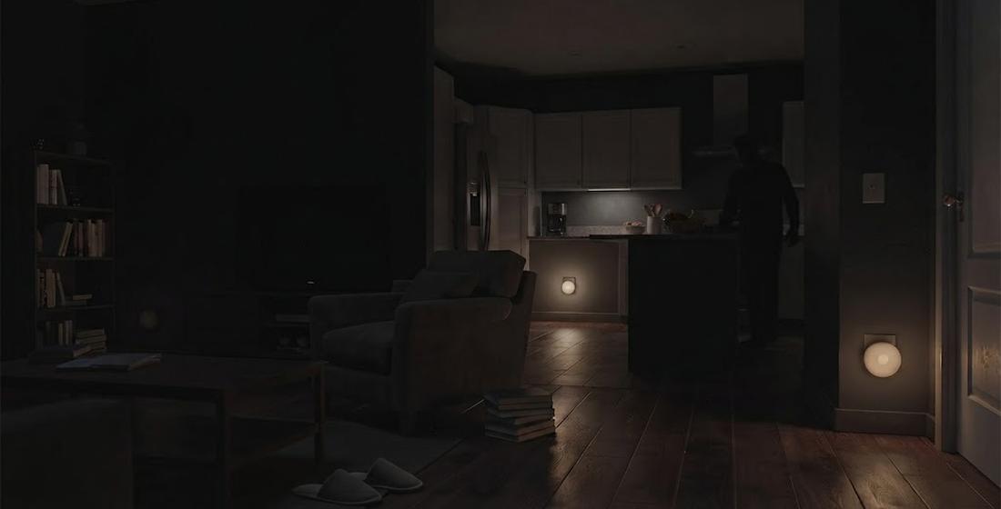 Dark room with barely any lighting — a threatening silhouette stands at the kitchen counter, impossible to identify or assess