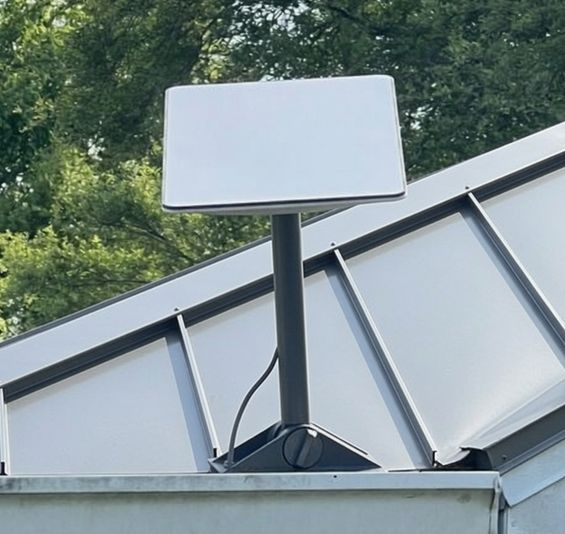 Real Starlink satellite dish mounted on a roof