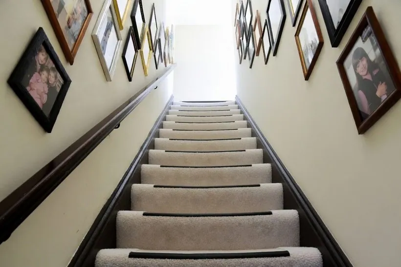 The same staircase with a dark contrasting strip along the front edge of every tread, so each step edge reads as a clear line