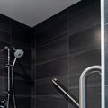 Horizontal and angled grab bars inside shower
