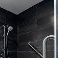 Horizontal and angled grab bars inside shower